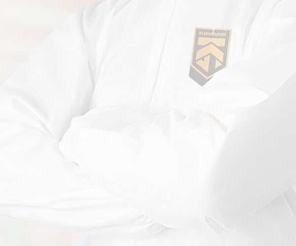 Worker wearing KleenGuard™ white zip-front coveralls